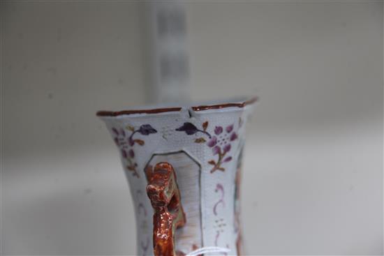 A pair of Chinese famille rose Mandarin hexagonal baluster vases, Qianlong period, height 27.5cm, slight damage